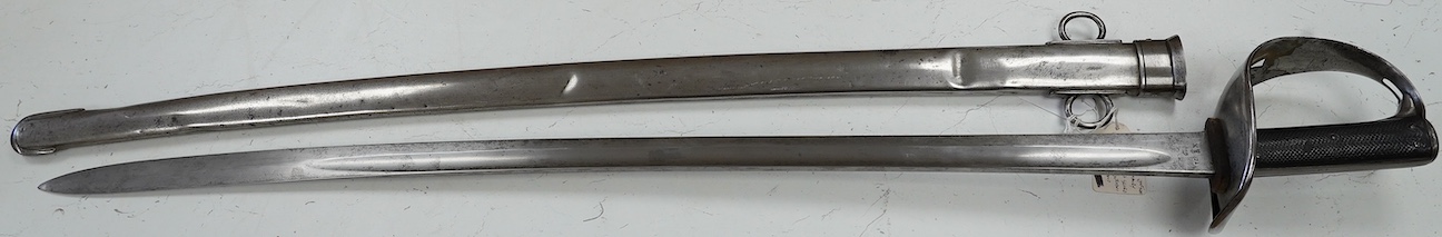 An 1893 pattern Cavalry Trooper’s sword, first issued to the 9th Lancers, and subsequently to the Derbyshire Yeomanry, in its steel scabbard, blade 86.5cm. Condition - generally good condition, some dents to scabbard